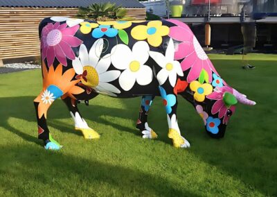 VACHE FLEURS TETE BASSE