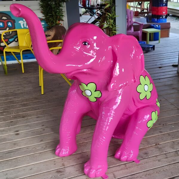 STATUE ELEPHANT ASSIS EN RESINE AVEC FLEURS